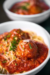 bowls of spaghetti and meat meatballs