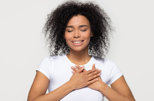 Image shows a woman with her eyes closed and her hands over her heart which may represent a woman loving herself. 

Loving yourself can come in many different forms. 

In order to be truly happy, you must do what you need to do for yourself, unapologetically. Individual therapy is offered at our Woodland Hills, CA therapy practice. 91364 | 91307 | 91356