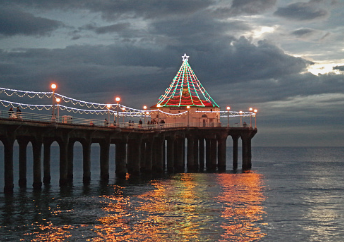 The image shows a big electric light christmas tree on a dock at sunset overlooking the ocean. 
            
            
            Anxiety therapy and counseling in Woodland Hills, CA can help you feel connected. Meet with an online marriage counselor in Woodland Hills, CA with online therapy in California here.  90077 | 91324 | 91364 | 91411 | 91436