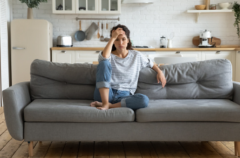 A woman is sitting on her couch with her hand on her forehead. Feelings of regret and dwelling on past mistakes can lead into depressive thoughts. Therapy is helpful in coping with your negative thoughts and depression. We offer individual therapy at our Woodland Hills therapy office, either virtually or in person. 91364 | 91307 | 91356
