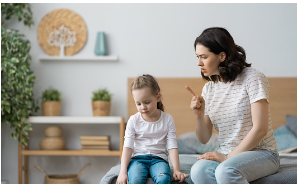 In this image we see a mother and daughter in a bedroom sitting on the end of the bed. The mother is holding her finger towards her daughter scolding her, while the young girl is looking down in shame. Having negative experiences with failure can cause you to have a fear of failure in your adulthood. Virtual and in person therapy is offered at our Los Angeles, CA therapy office. 91364 | 91307 | 91356