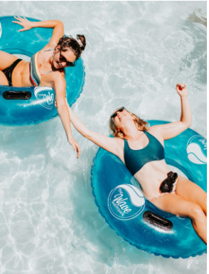 two white women laying on a floaty in a pool reaching for each other. Is your anxiety getting in the way of your friendships and spending time with others? Individual therapy can help you learn relationship skills in person in Calabasas or online in CA