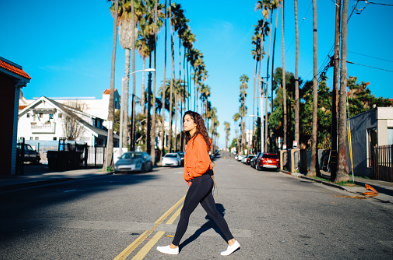 Young mixed Latina woman enjoying the walk on the streets of Santa Monica, Los Angeles. She is wearing a fashionable spring jacket, going to meet her friends near the beach. If you want to feel happier and be calmer, therapy for anxiety can help improve your self-esteem. Santa Monica, CA