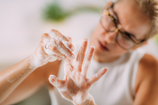 Obsessive compulsive disorder concept. Woman obsessively washing her hands. You can get help and anxiety treatment in Los Angeles, CA with a skilled Anxiety therapist via online therapy in California here. OCD, or obsessive compulsive disorder, can also be helped here as well. 91307