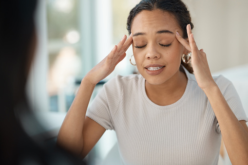 A hispanic woman eyes closed has her hands by her forehead that depicts "I feel like I'm going insane!" This photo represents feeling exhausted, anxious, worried, and nervous about stressors. If you are struggling with depression and low self-esteem, individual therapy can help overcome depression and negative self-talk. CBT therapy can teach you skills to challenge your thoughts and manage depression. Call today. 91307