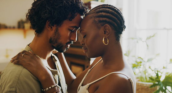 A picture of African-American couple hugging each other, touching forehead, eyes closed, in the middle of their apartment. Couples therapy and marriage counseling in Los Angeles, CA with a marriage counselor via online therapy in California can help you feel happy again. 91326 | 91303 | 91307 | 91377 | 91320 