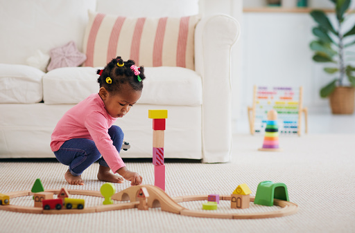 African-American toddler baby girl playing wooden toys on the carpet at home.  Learning better parenting skills to manage your child's anxiety l is possible with help from an anxiety therapist in Los Angeles, CA for anxiety treatment via online therapy in California.
91364 | 91307 | 91356 | 91301 | 91302 | 91372 | 91367 