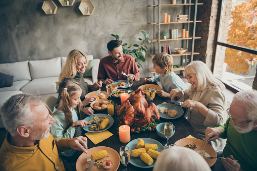 A family having a dinner, and enjoying their company. This photo represents healthy and positive family relationships with healthy Boundaries.