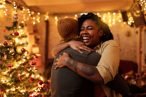An African-American Couple hugging on Christmas eve next to their Christmas tree feeling happy and joyous to celebrate the new year 2023. 
        Turn Holiday Chaos Into Holiday Joy!
        You can feel this free after couples therapy and marriage counseling in Woodland Hills, CA with a marriage counselor via online therapy in California here. 91364 | 91307 | 91356 | 91301 | 91302 | 91372 | 91367 