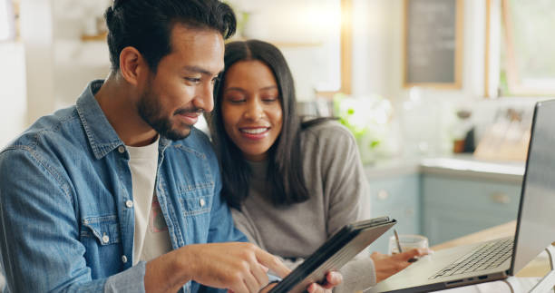 Home, typing and couple with a tablet, planning a meal and communication with social media, speaking and internet connection. Network, man and woman with technology, marriage and website information