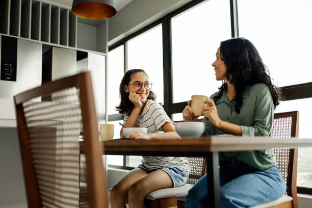 Mother-daughter connection: The kitchen becomes a hub of shared laughter and deep conversations between a mom and her teenager Connect with your teen