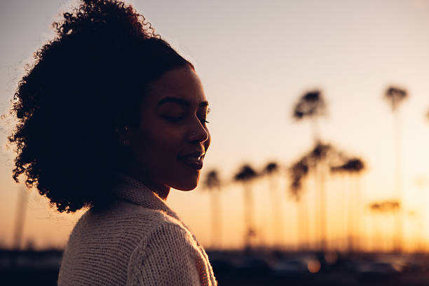 Silhouette of a woman at sunset in California.